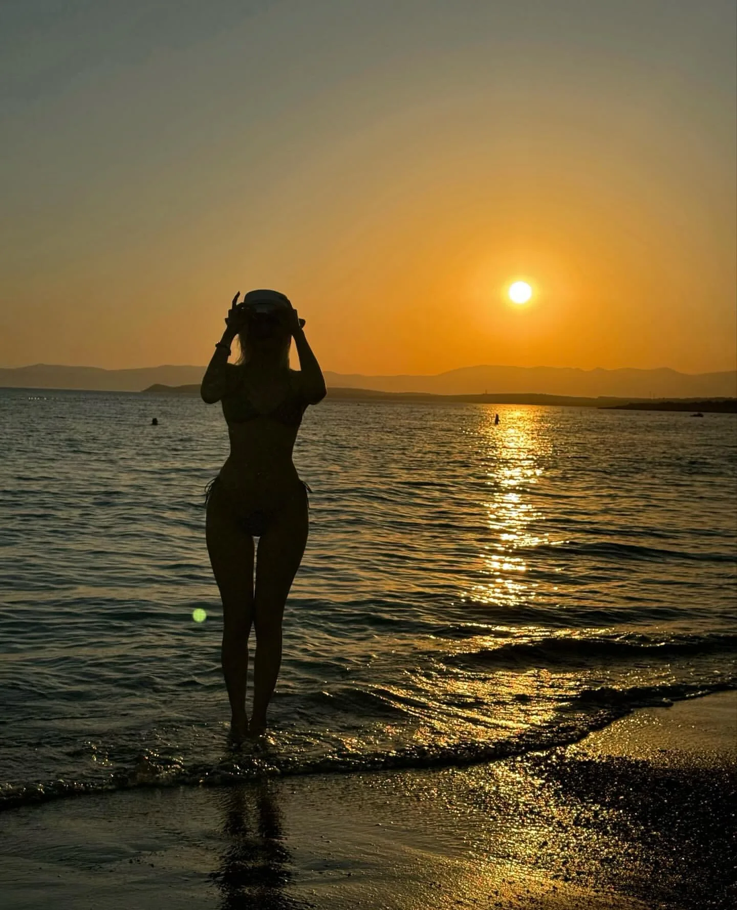 Salt air, gilded skin.